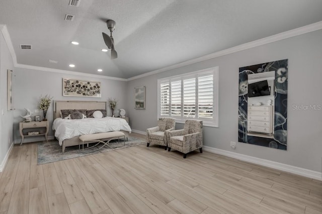 bedroom with ornamental molding, lofted ceiling, light hardwood / wood-style flooring, and a textured ceiling