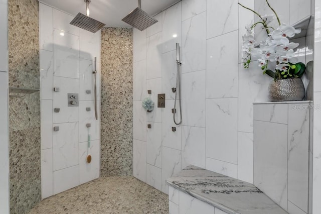 bathroom featuring a tile shower