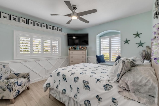 bedroom with ceiling fan and light hardwood / wood-style floors