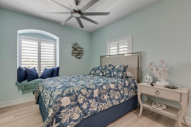 bedroom featuring hardwood / wood-style flooring and ceiling fan