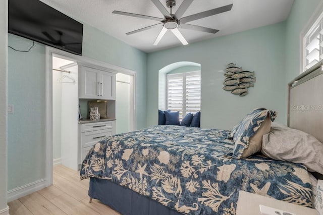 bedroom featuring light hardwood / wood-style flooring and ceiling fan