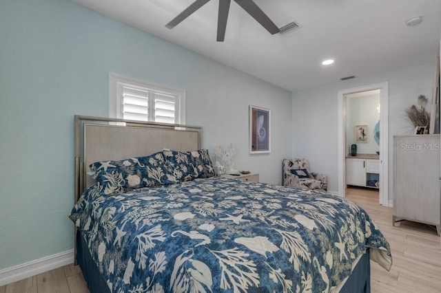 bedroom with connected bathroom, ceiling fan, and light hardwood / wood-style floors