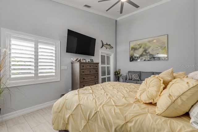 bedroom with ceiling fan and crown molding