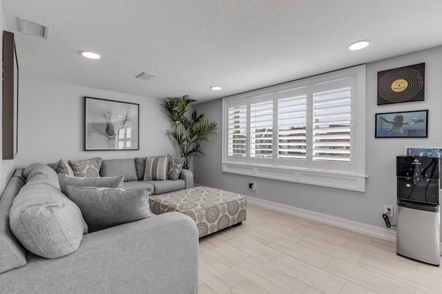 living room featuring a textured ceiling