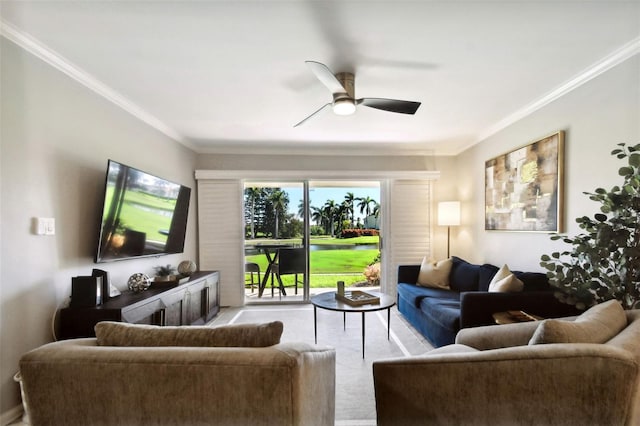 living room featuring crown molding and ceiling fan