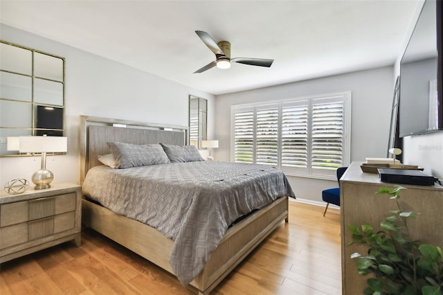 bedroom with ceiling fan and light wood-type flooring