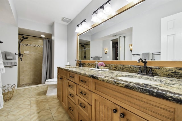 bathroom with vanity, toilet, and a shower with curtain