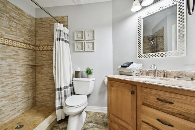 bathroom with vanity, toilet, and curtained shower