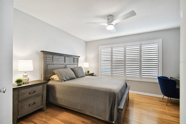 bedroom with light hardwood / wood-style flooring and ceiling fan