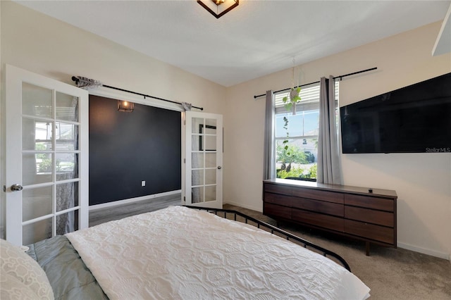 carpeted bedroom featuring french doors