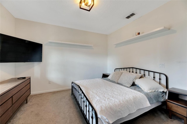 bedroom with light colored carpet