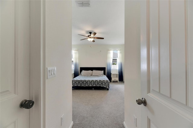 carpeted bedroom with ceiling fan