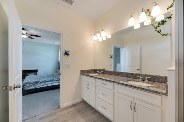 bathroom with vanity, wood-type flooring, and ceiling fan