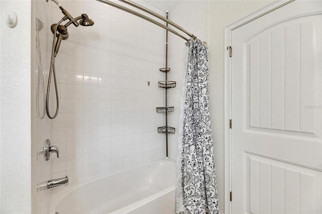 bathroom with shower / bathtub combination with curtain