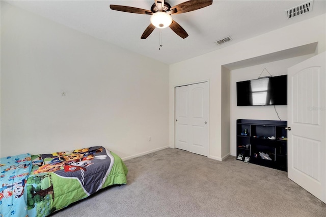 bedroom featuring ceiling fan and light carpet