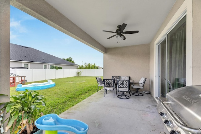 view of patio with ceiling fan