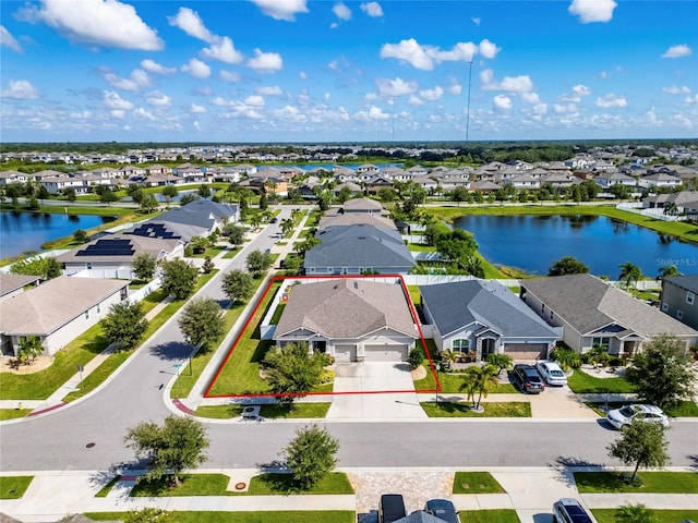 drone / aerial view with a water view