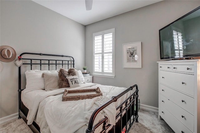 bedroom featuring ceiling fan and light colored carpet