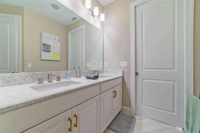 bathroom featuring tile patterned floors and vanity