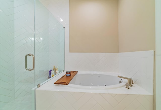 bathroom with shower with separate bathtub