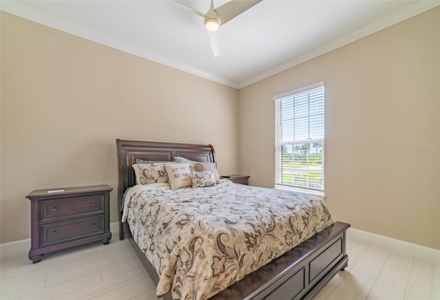 bedroom featuring light hardwood / wood-style flooring, ceiling fan, and ornamental molding