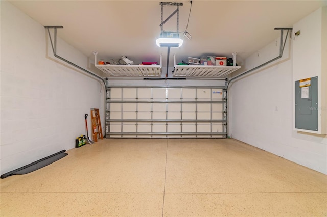 garage with electric panel and a garage door opener