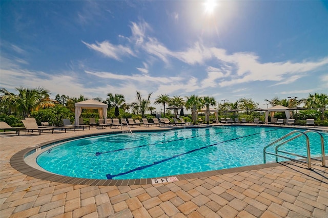 view of pool featuring a patio area and a gazebo