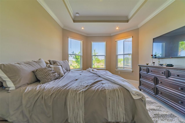 bedroom featuring a tray ceiling and ornamental molding