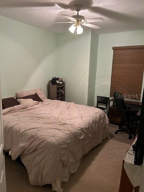 bedroom featuring ceiling fan and carpet flooring