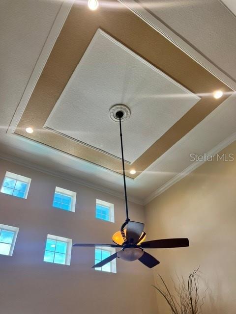 details featuring ceiling fan and ornamental molding