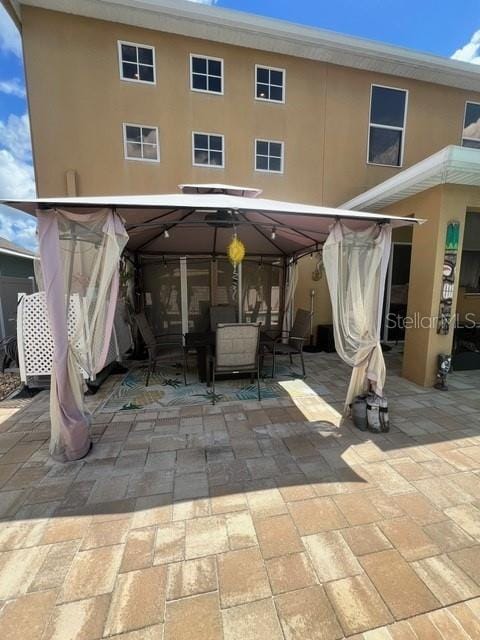 rear view of house with a patio