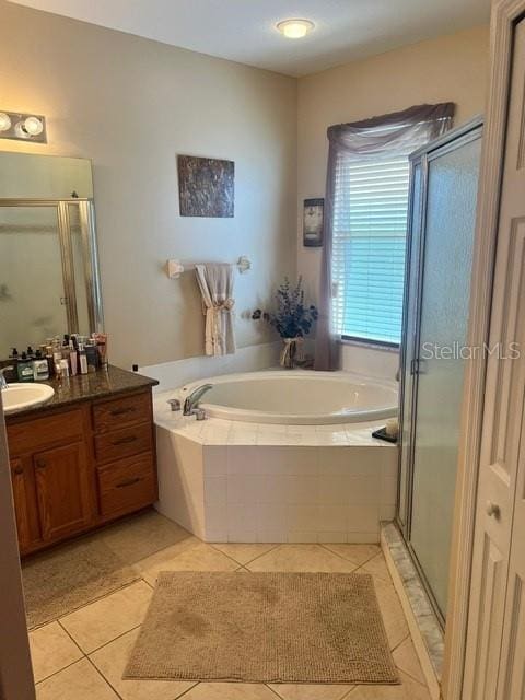 bathroom featuring tile patterned floors, separate shower and tub, and vanity