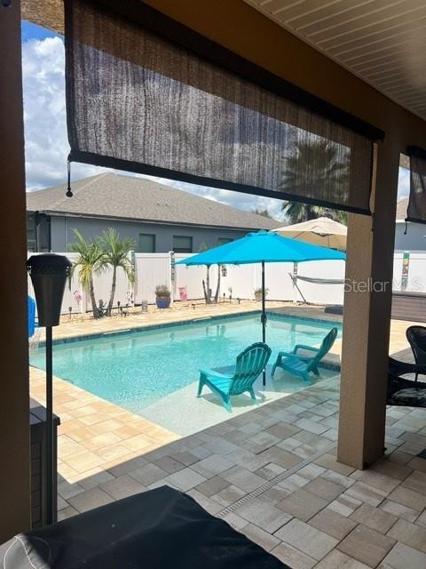 view of swimming pool with a patio area