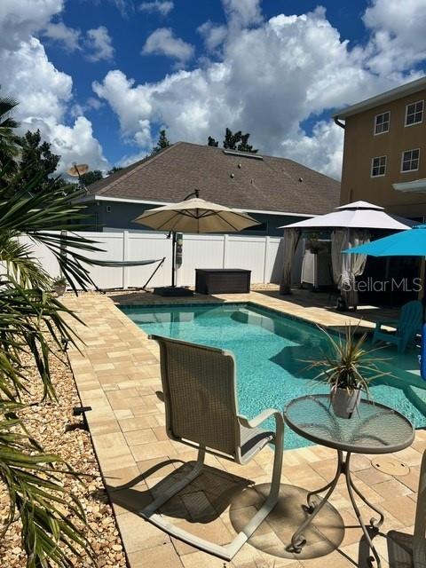 view of swimming pool featuring a patio