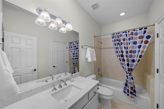 full bathroom featuring tile patterned flooring, vanity, shower / bath combination with curtain, and toilet