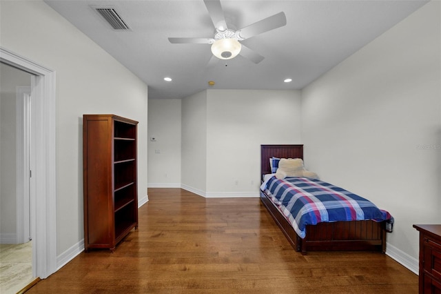 bedroom featuring ceiling fan and dark hardwood / wood-style floors