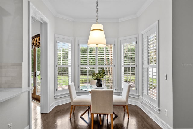 dining space featuring dark wood-type flooring and ornamental molding