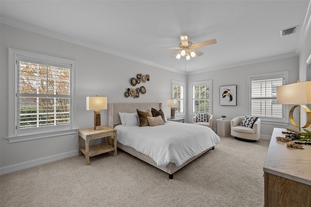 bedroom with ceiling fan, ornamental molding, and carpet floors