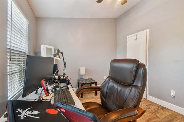 office with light hardwood / wood-style flooring and ceiling fan