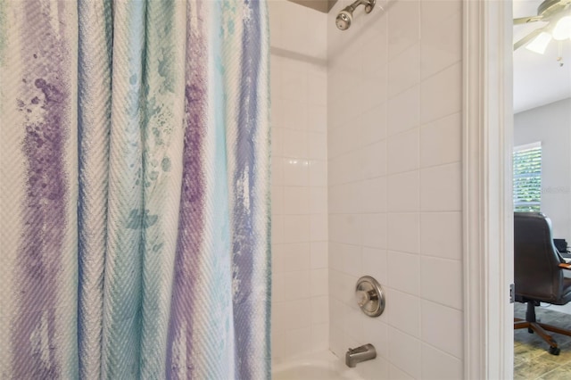 bathroom featuring shower / tub combo and ceiling fan