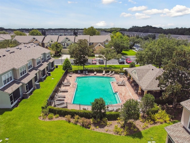 view of swimming pool with a lawn and a patio