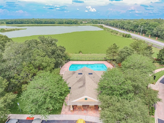 view of pool with a water view