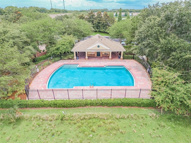 4538 Kennewick Pl, Riverview, FL 33578 - community pool with a patio, fence, and an outdoor structure