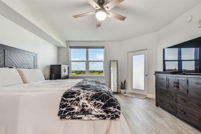 bedroom with ceiling fan and light wood-type flooring