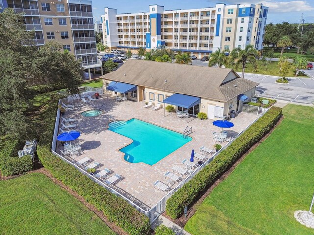 view of pool featuring a yard and a patio