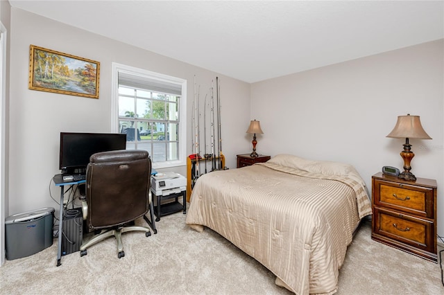 bedroom featuring light colored carpet