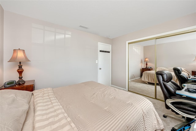 carpeted bedroom with a closet