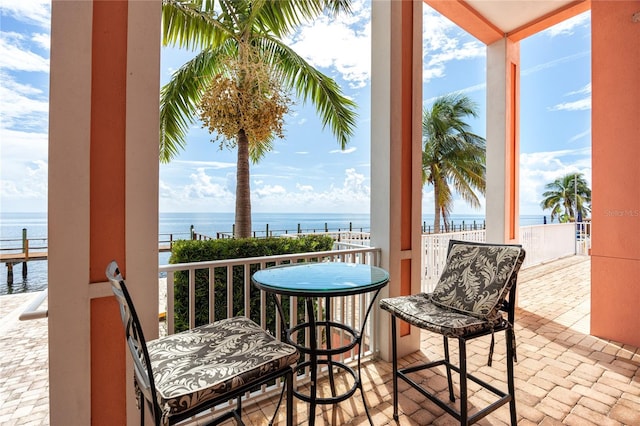 balcony featuring a water view