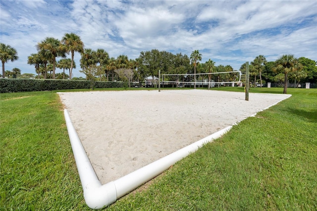 view of community featuring a lawn and volleyball court