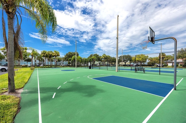 view of basketball court featuring tennis court